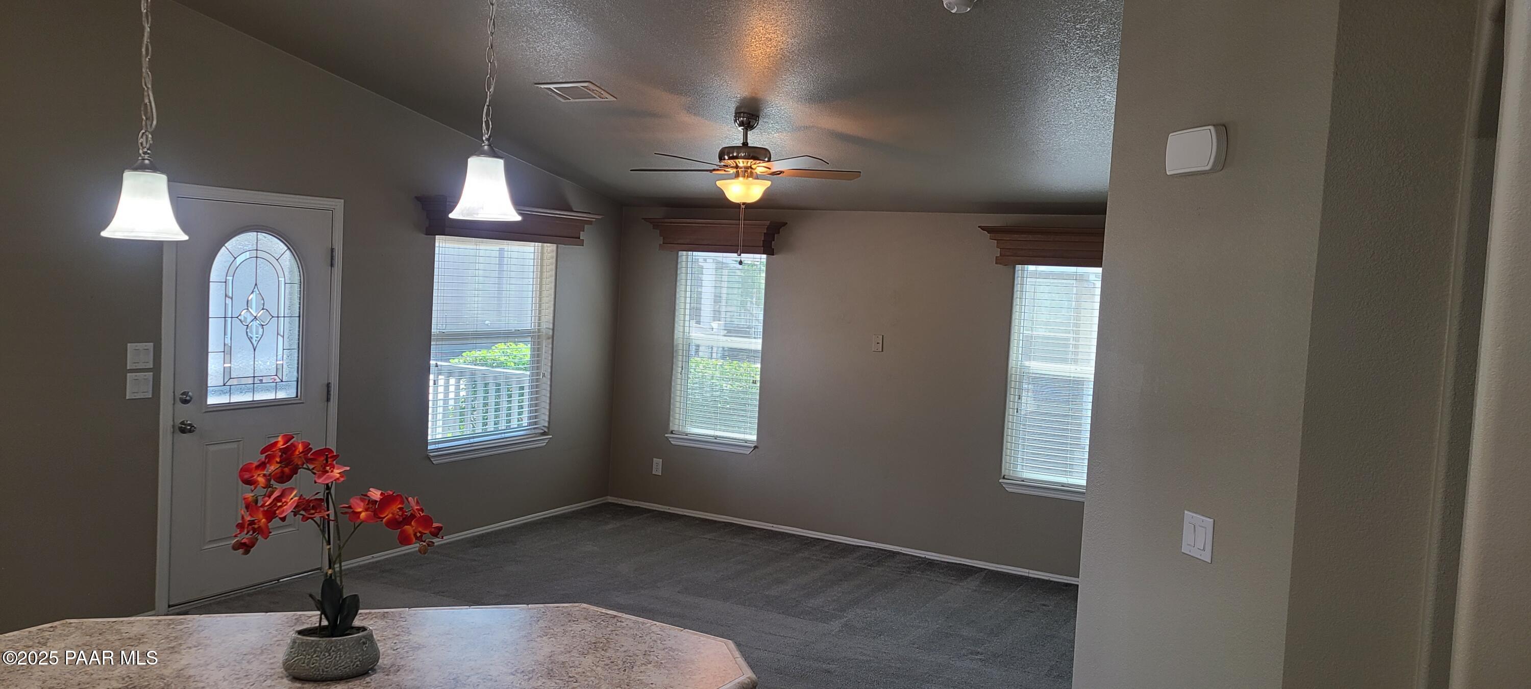 2146 Jackrabbit Drive, Unit 2146 Dewey, AZ 86327 - Photo 7 of 48 a view of a livingroom with a ceiling fan and window