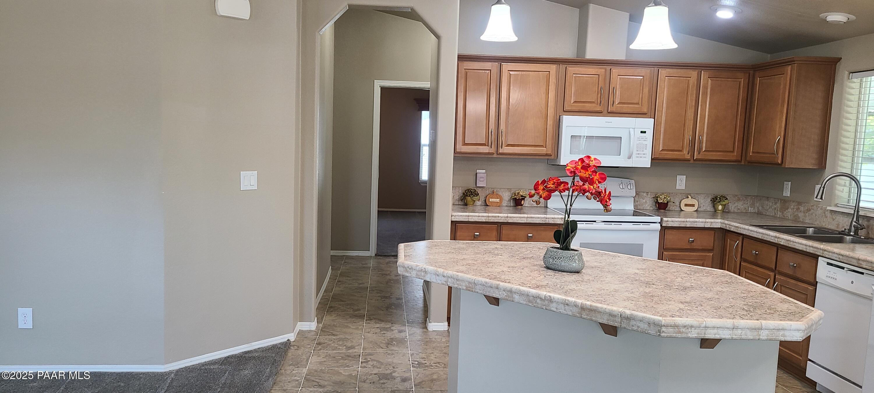 2146 Jackrabbit Drive, Unit 2146 Dewey, AZ 86327 - Photo 9 of 48 a kitchen with stainless steel appliances granite countertop a sink refrigerator and cabinets