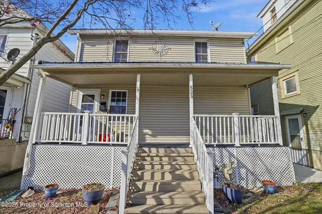 a kitchen with granite countertop a sink a stove and cabinets