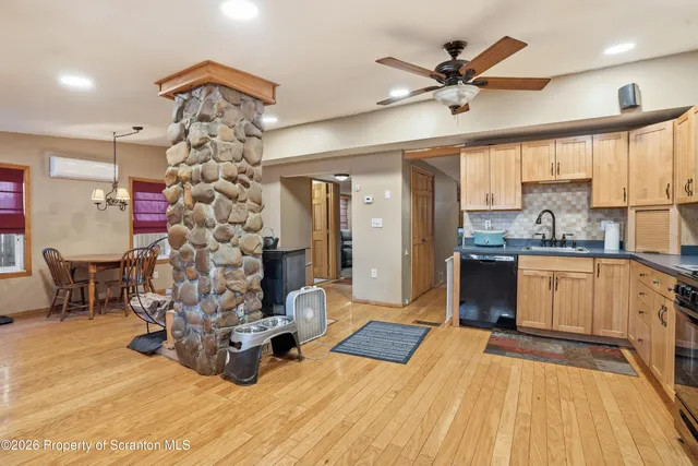a dining room with furniture and window