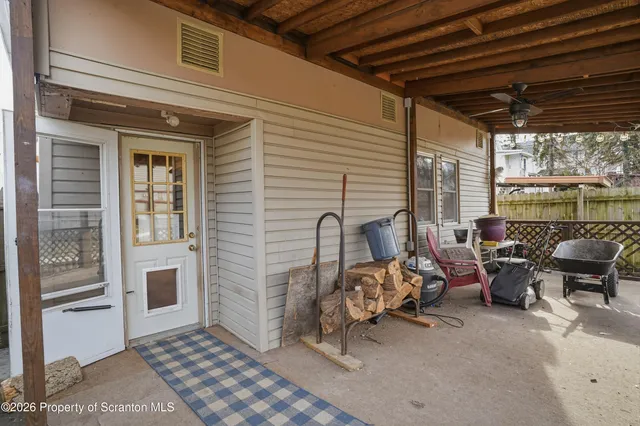 an aerial view of a house with a mountain