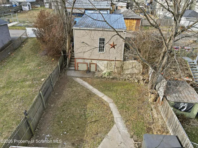 a aerial view of a house with a yard