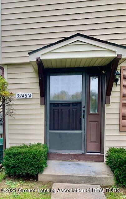 3948 Hunters Ridge Drive, Unit 4 Lansing, MI 48911 - Photo 2 of 23 Front