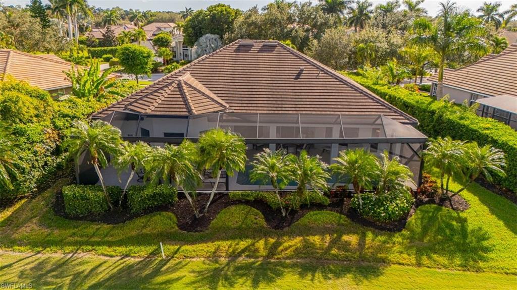 7984 Tiger Lily Drive Naples, FL 34113 - Photo 36 of 45 a view of a house with backyard and sitting area