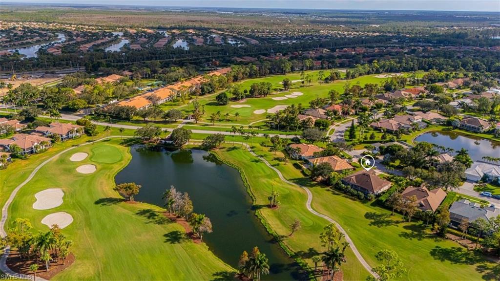 7984 Tiger Lily Drive Naples, FL 34113 - Photo 38 of 45 an aerial view of residential houses with outdoor space