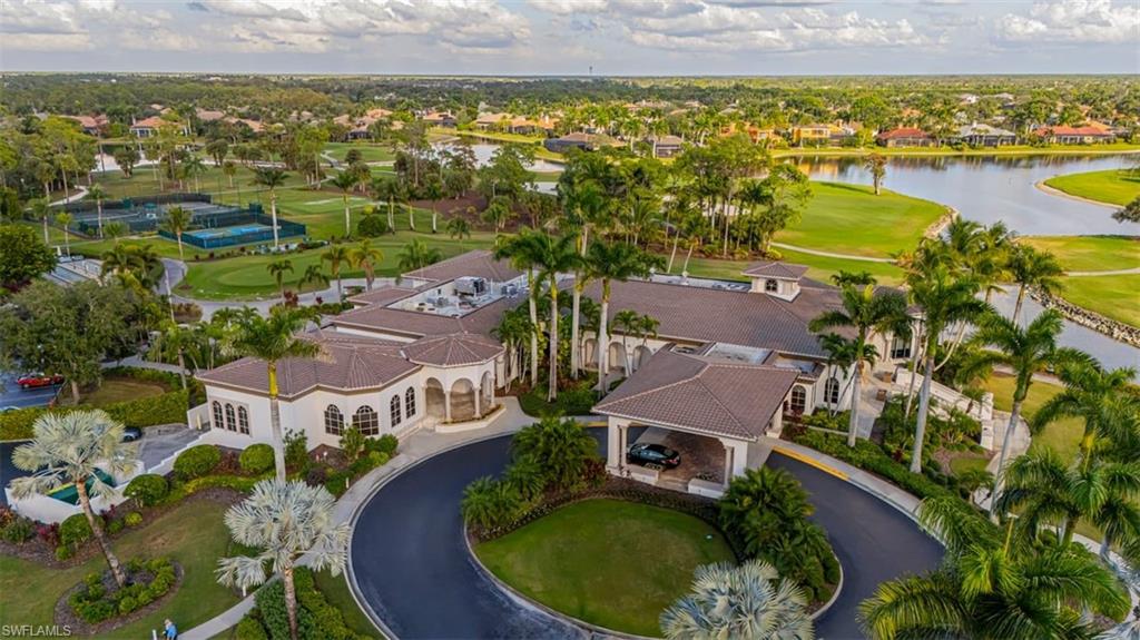 7984 Tiger Lily Drive Naples, FL 34113 - Photo 42 of 45 an aerial view of residential houses with outdoor space and ocean view