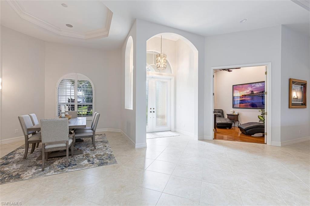 7984 Tiger Lily Drive Naples, FL 34113 - Photo 7 of 45 a view of a livingroom with furniture and a window