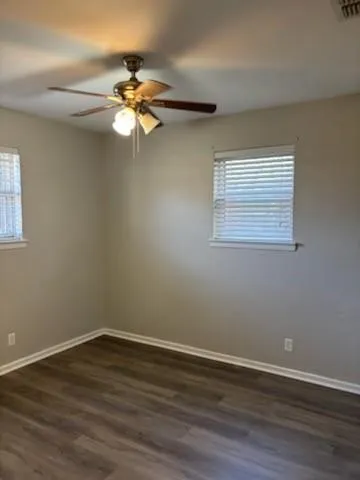a view of a workspace with wooden floor