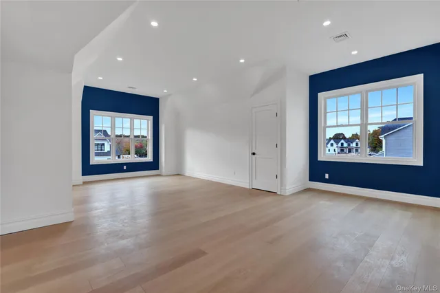 an empty room with window and furniture