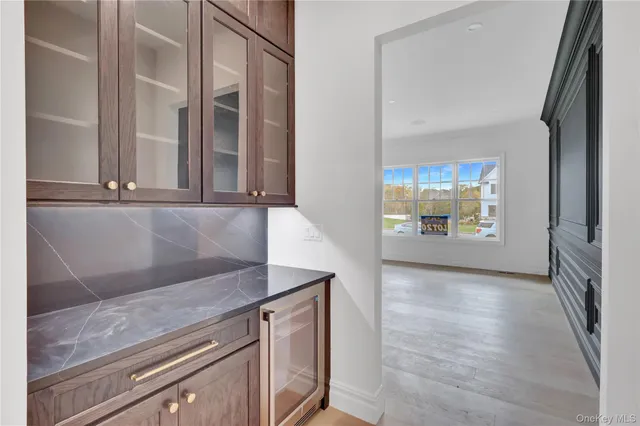 a kitchen with sink and view of living room