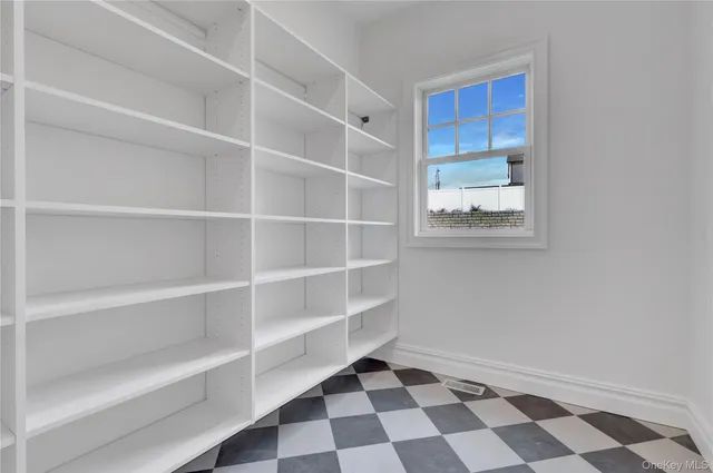 a view of a room with a black white checkered floor