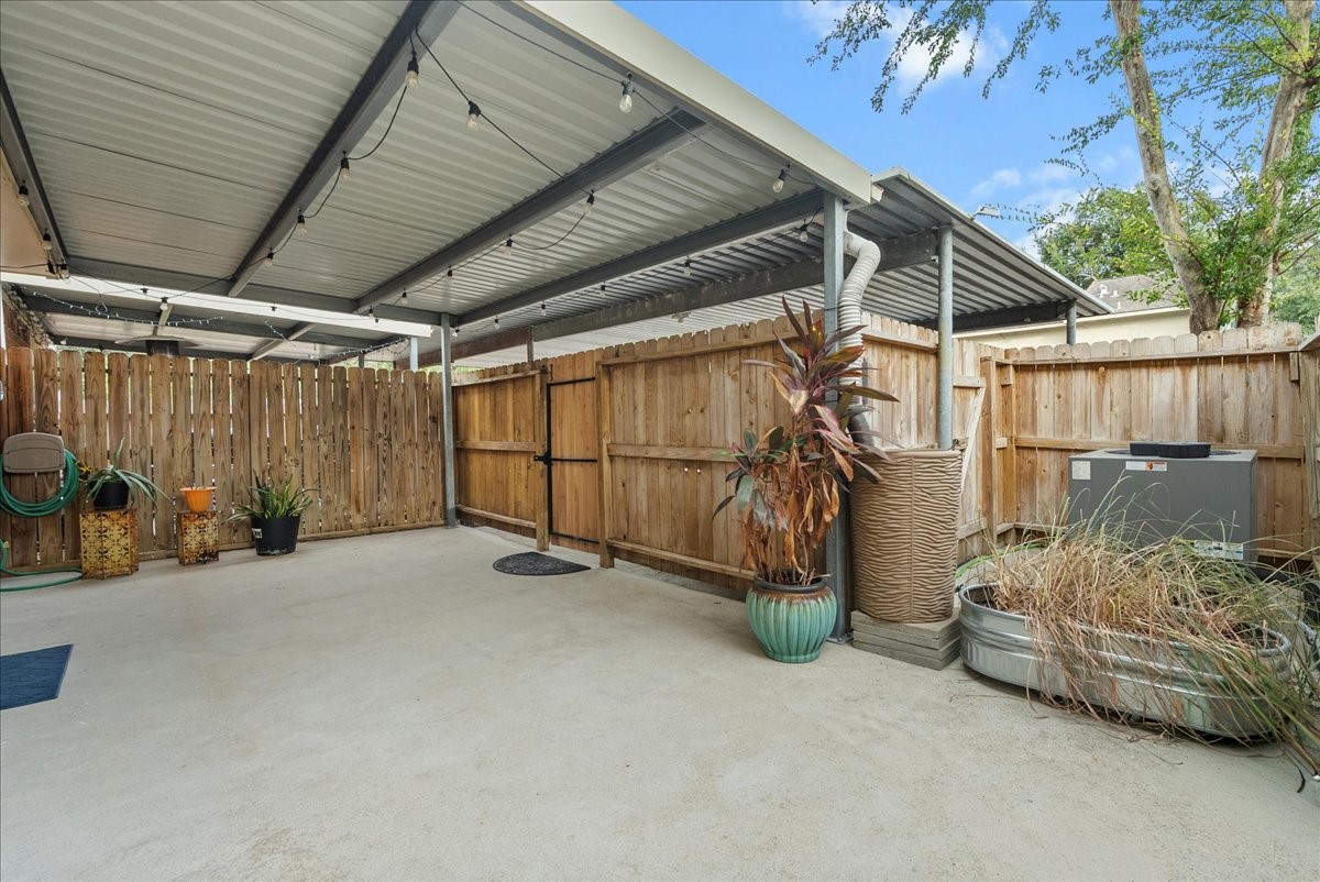 1572 Silverpines Road, Unit 572 Houston, TX 77062 - Photo 28 of 37 The patio area is completely fenced for privacy and allows for a great space to lounge, entertain, or enjoy the outdoors.