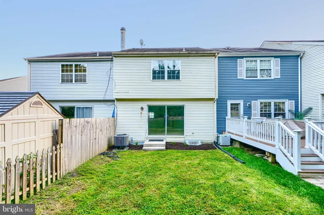 a front view of a house with a yard and porch