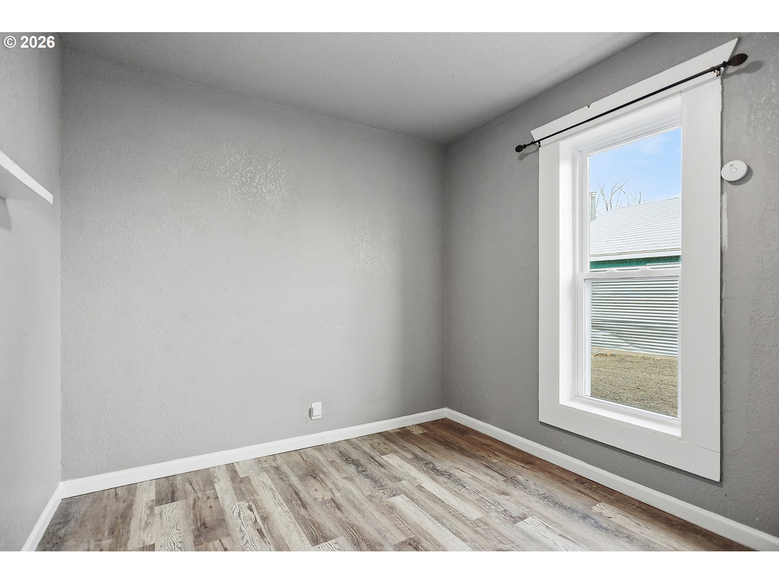 417 East Court Street Goldendale, WA 98620 - Photo 12 of 38 a view of an empty room with a window