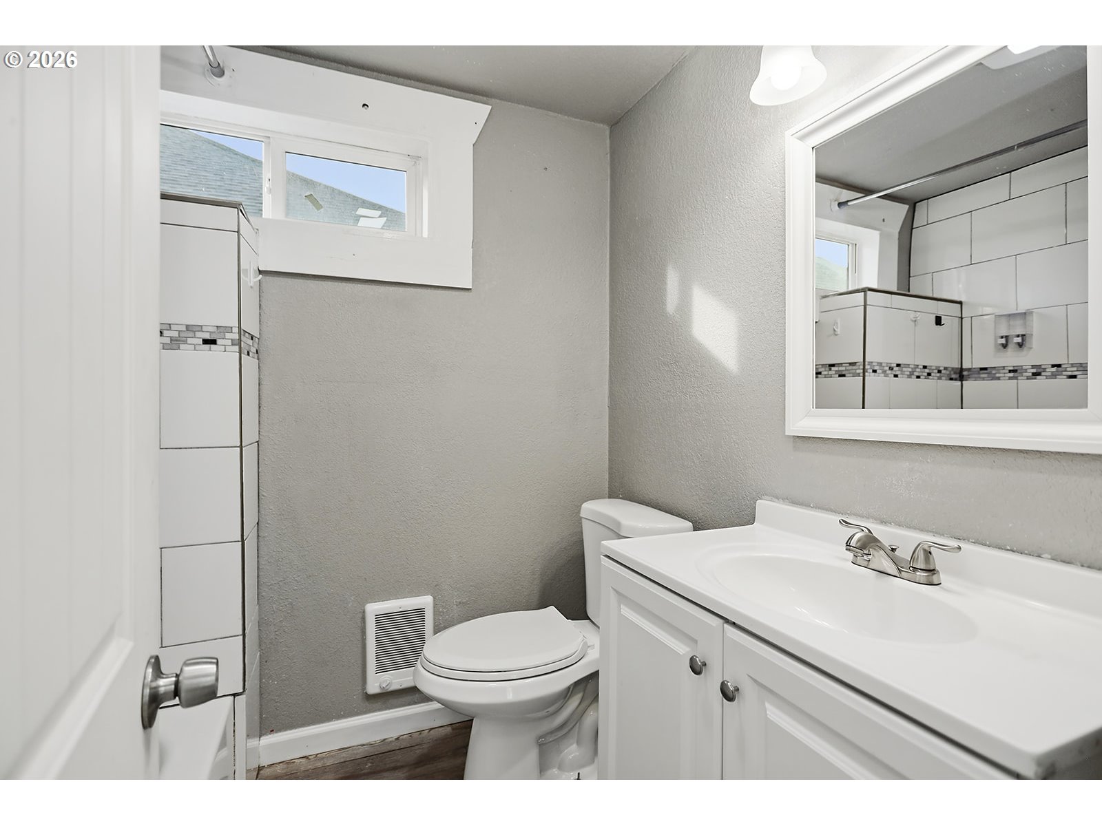417 East Court Street Goldendale, WA 98620 - Photo 19 of 38 a bathroom with a sink mirror vanity and toilet