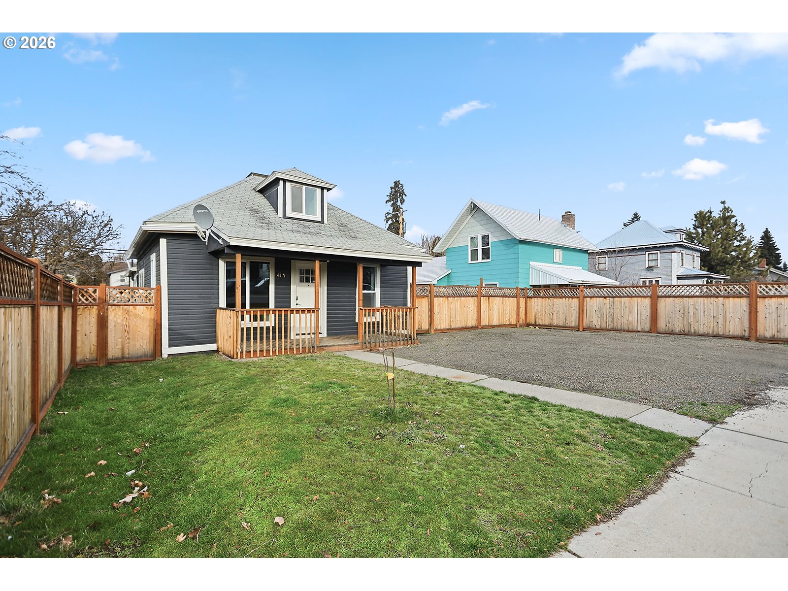 417 East Court Street Goldendale, WA 98620 - Photo 35 of 38 a front view of a house with a yard and garage