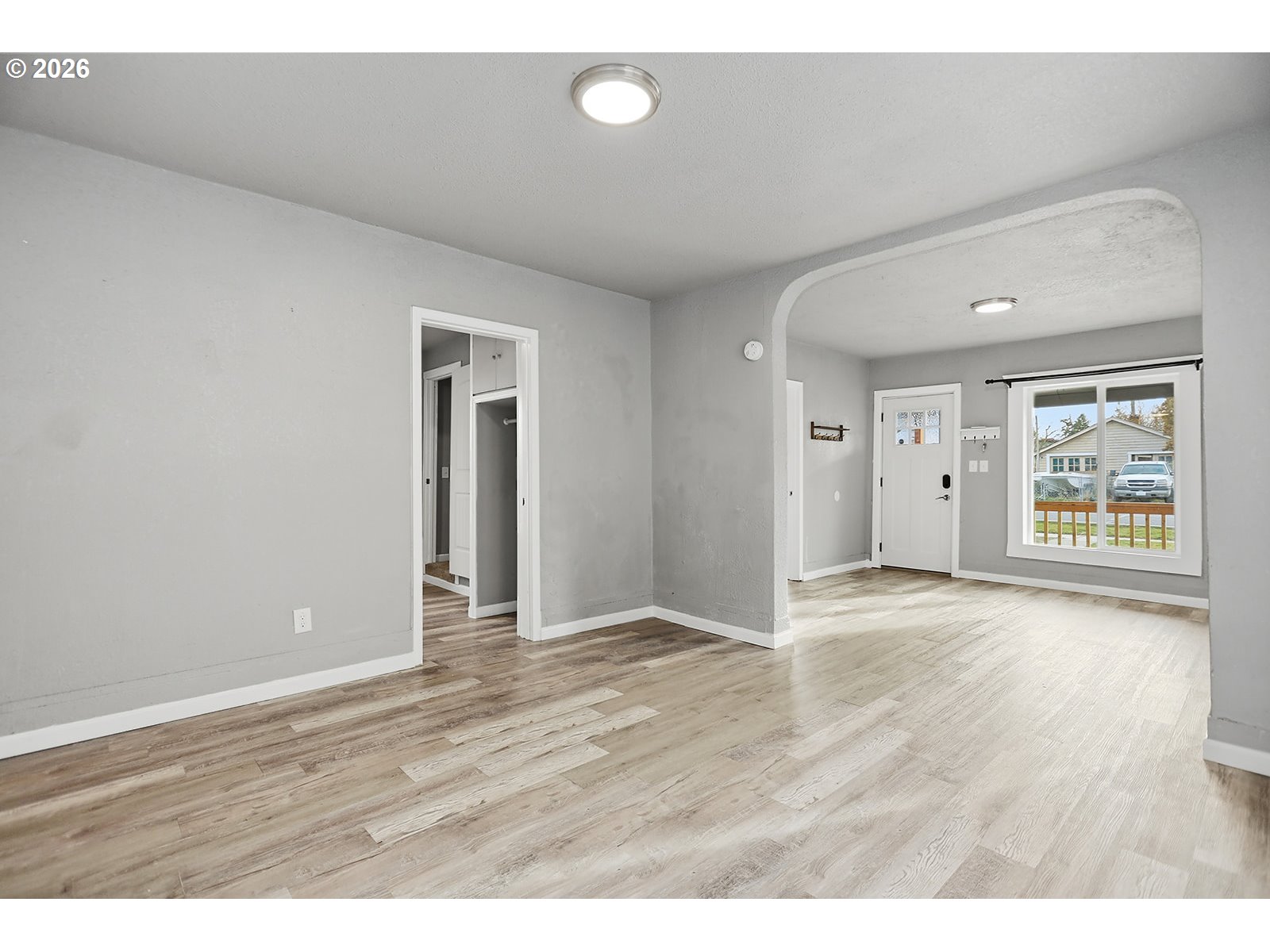 417 East Court Street Goldendale, WA 98620 - Photo 9 of 38 a view of an empty room with wooden floor and window