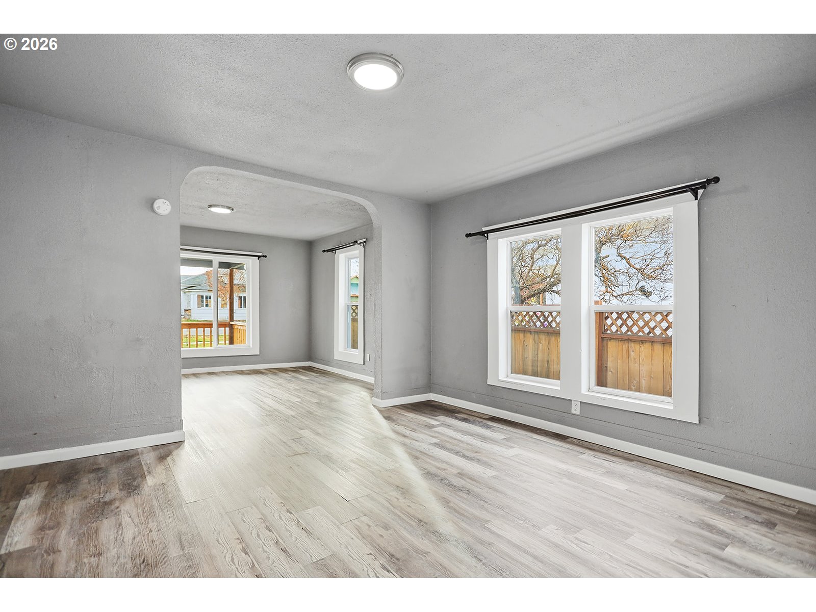 417 East Court Street Goldendale, WA 98620 - Photo 10 of 38 a view of an empty room with a window and wooden floor