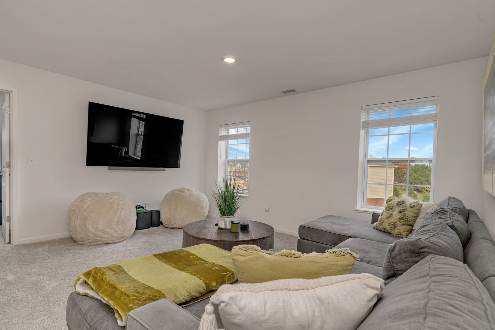 2108 Pembridge Lane Joliet, IL 60431 - Photo 19 of 35 a living room with furniture and a flat screen tv