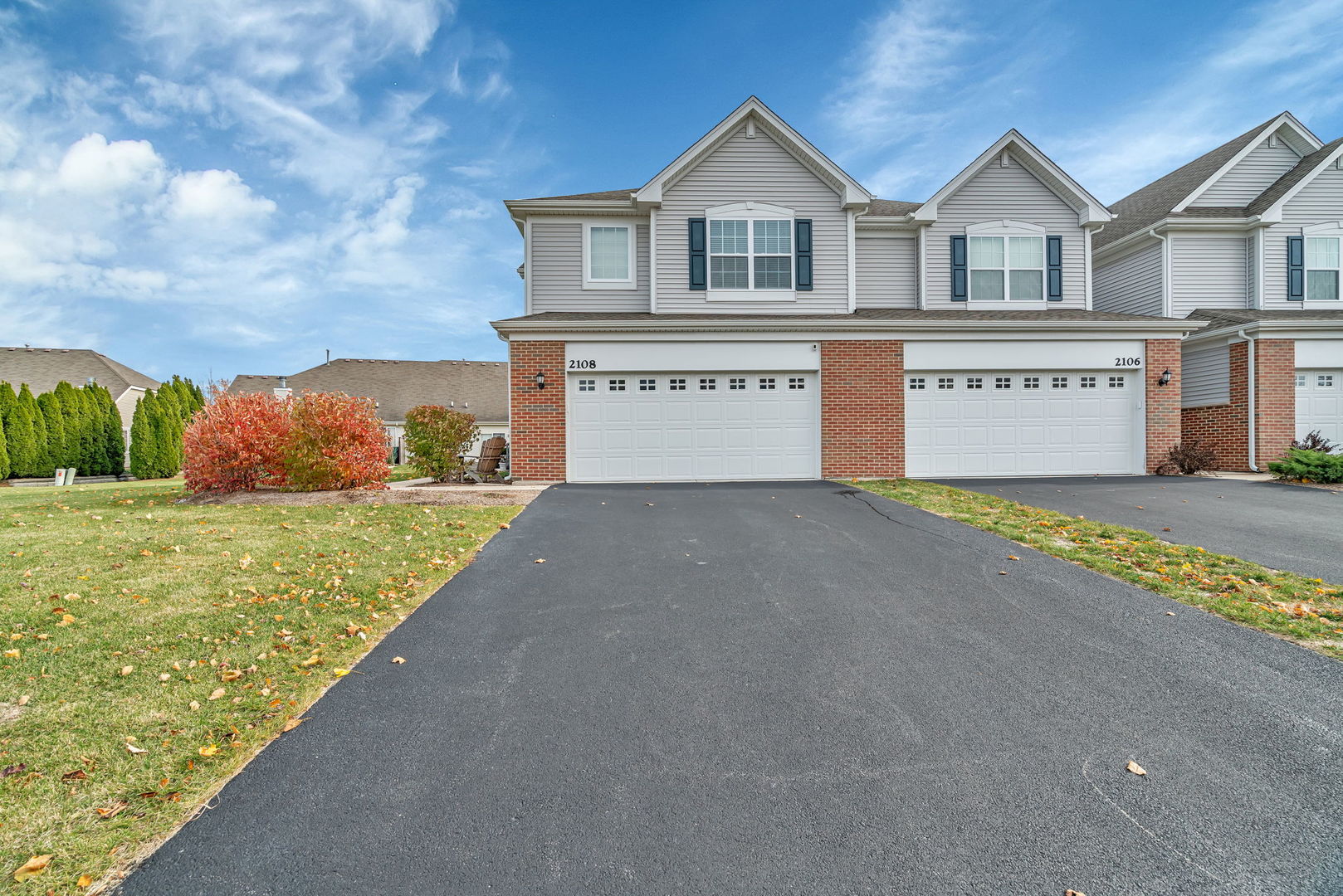 2108 Pembridge Lane Joliet, IL 60431 - Photo 2 of 35 a front view of a house with a yard and garage