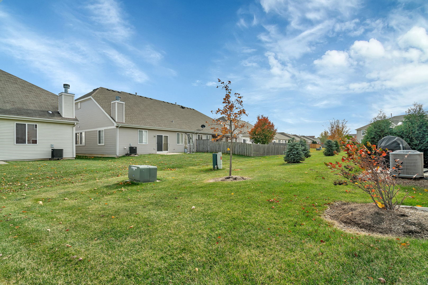 2108 Pembridge Lane Joliet, IL 60431 - Photo 29 of 35 a view of a house with a big yard potted plants and large tree