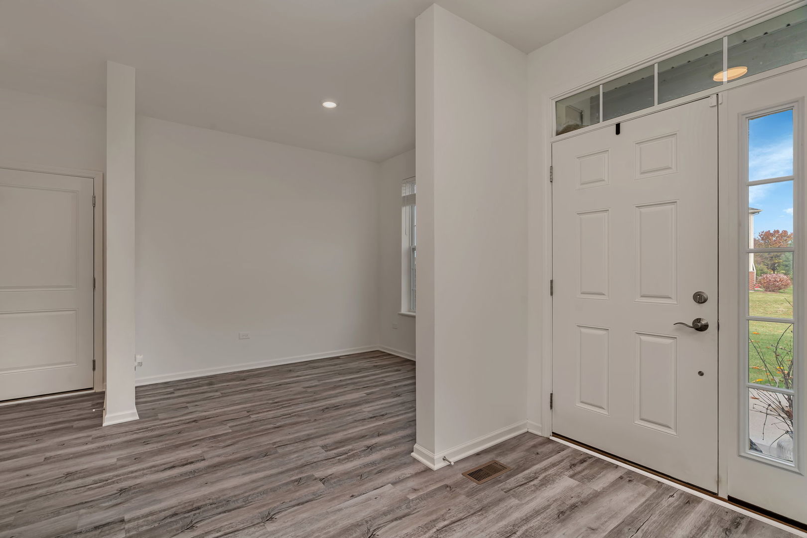 2108 Pembridge Lane Joliet, IL 60431 - Photo 5 of 35 a view of an empty room with wooden floor and entrance