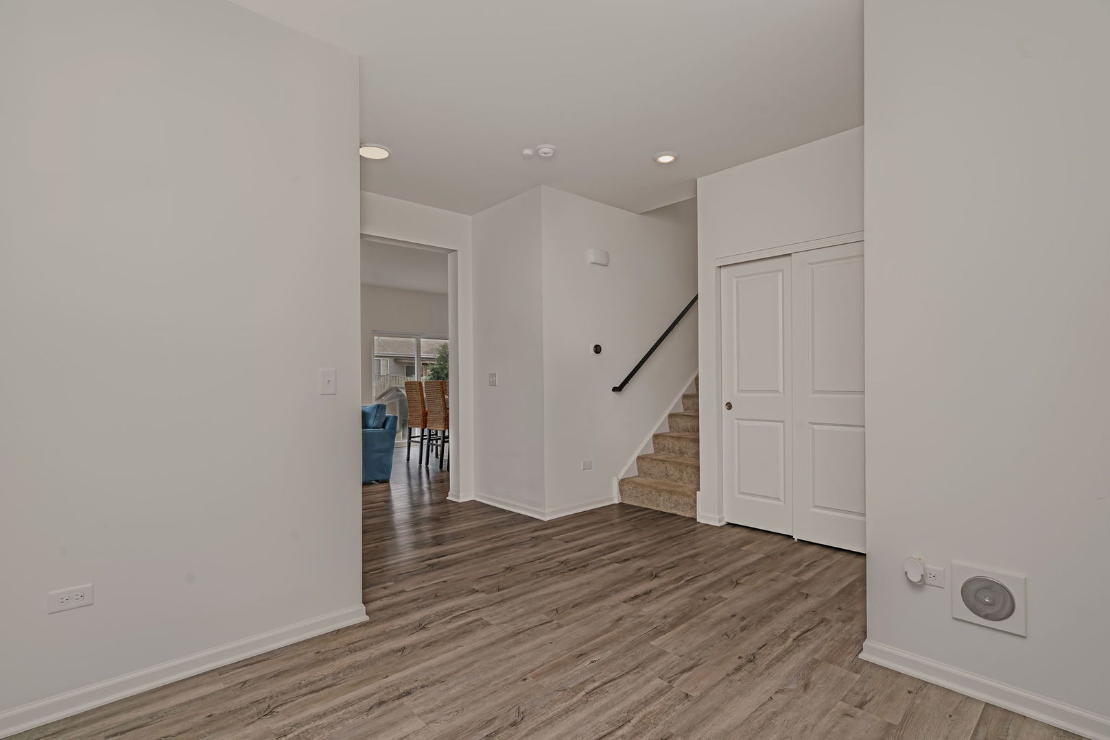 2108 Pembridge Lane Joliet, IL 60431 - Photo 7 of 35 a view of a hallway with wooden floor and staircase
