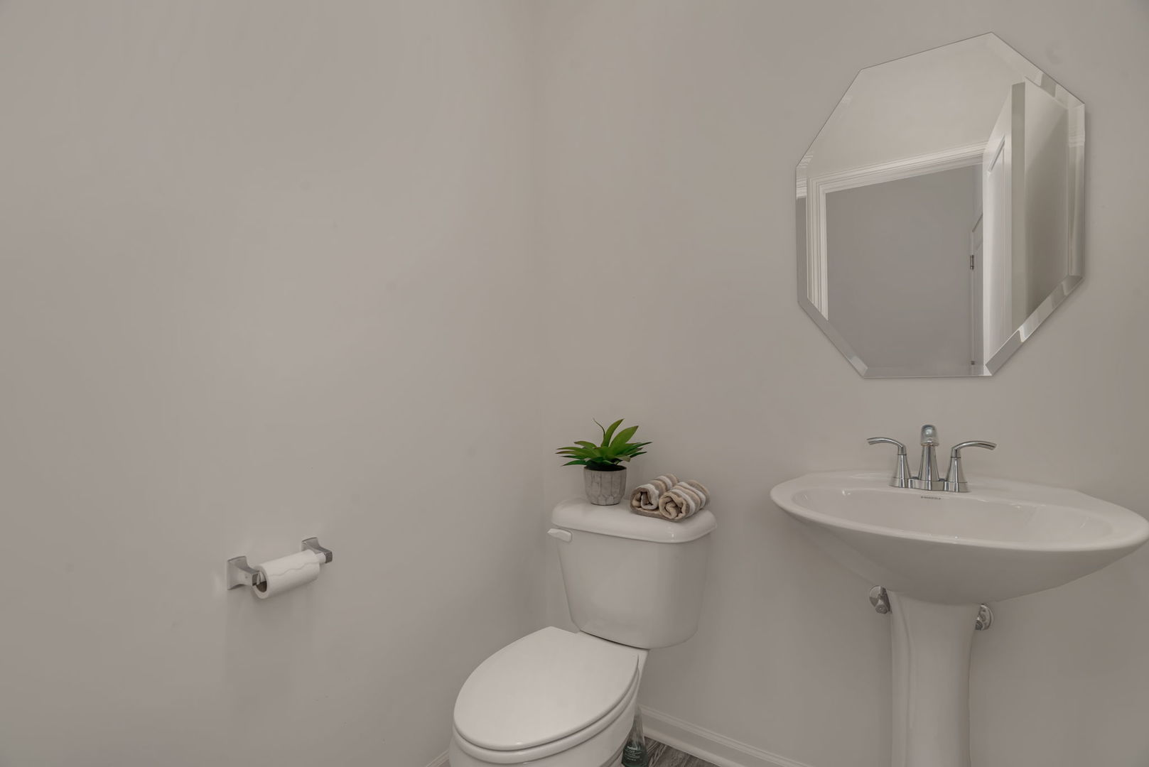 2108 Pembridge Lane Joliet, IL 60431 - Photo 8 of 35 a white toilet sitting next to a bathroom sink