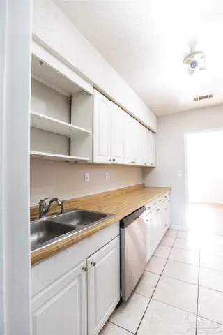 a kitchen with a sink and cabinets