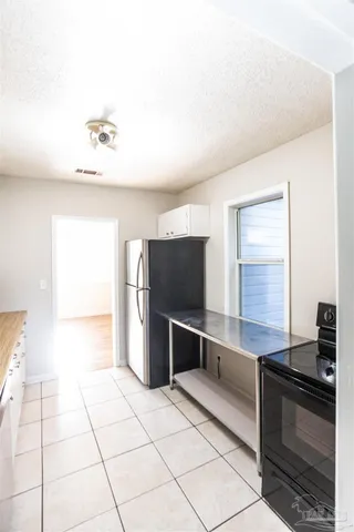 a spacious bathroom with a bathtub and a shower