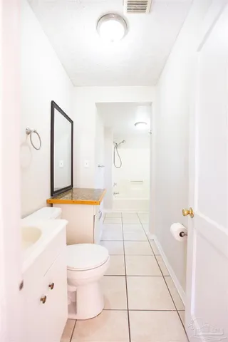 a bathroom with a sink a toilet and bathtub