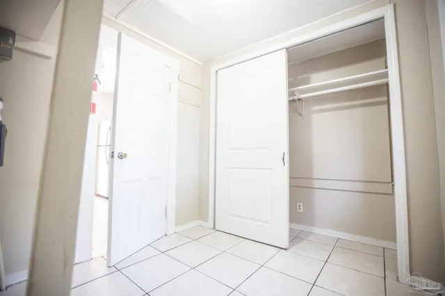 a view of a refrigerator in kitchen and white doors