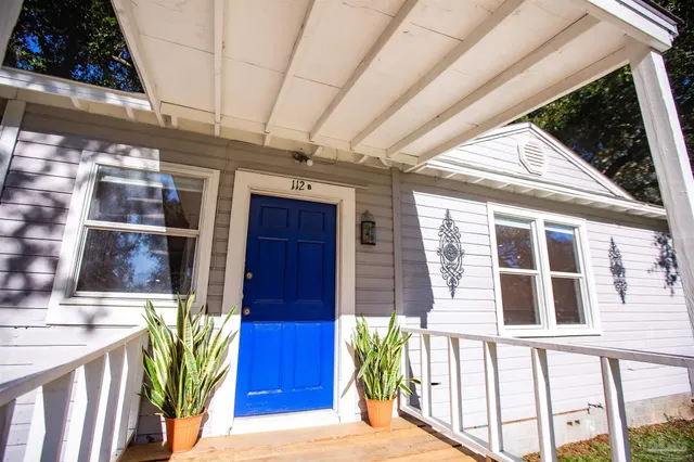 a view of balcony with furniture