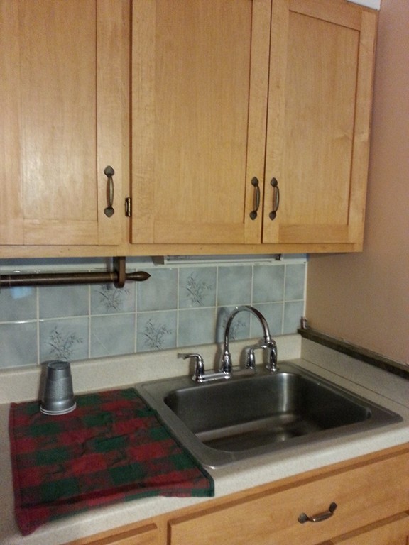 151 Riverside Drive Northampton, MA 01062 - Photo 9 of 17 a kitchen with a sink and cabinets