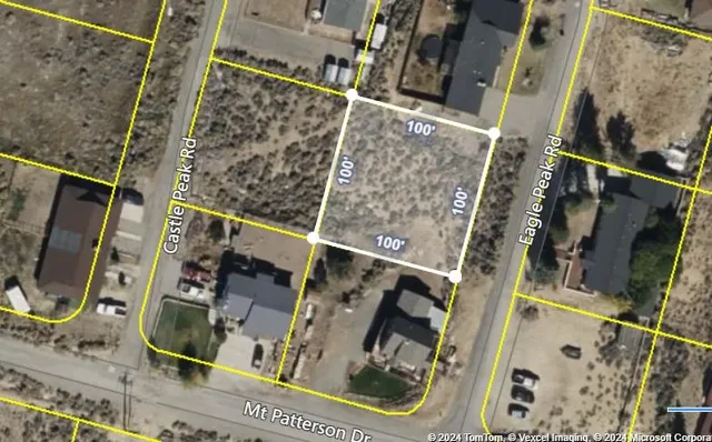 a view of a field with an ocean view