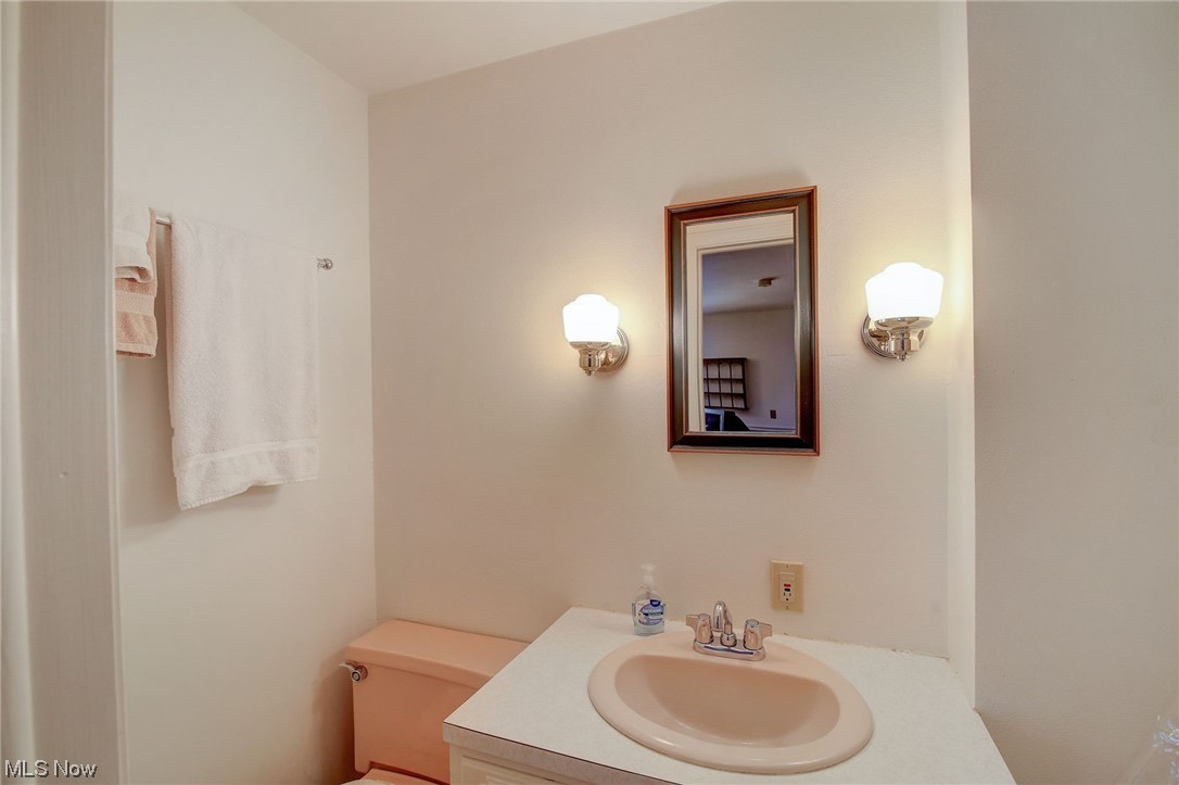 45555 North Ridge Road Amherst, OH 44001 - Photo 25 of 36 Studio bathroom featuring toilet and oversized vanity and shower