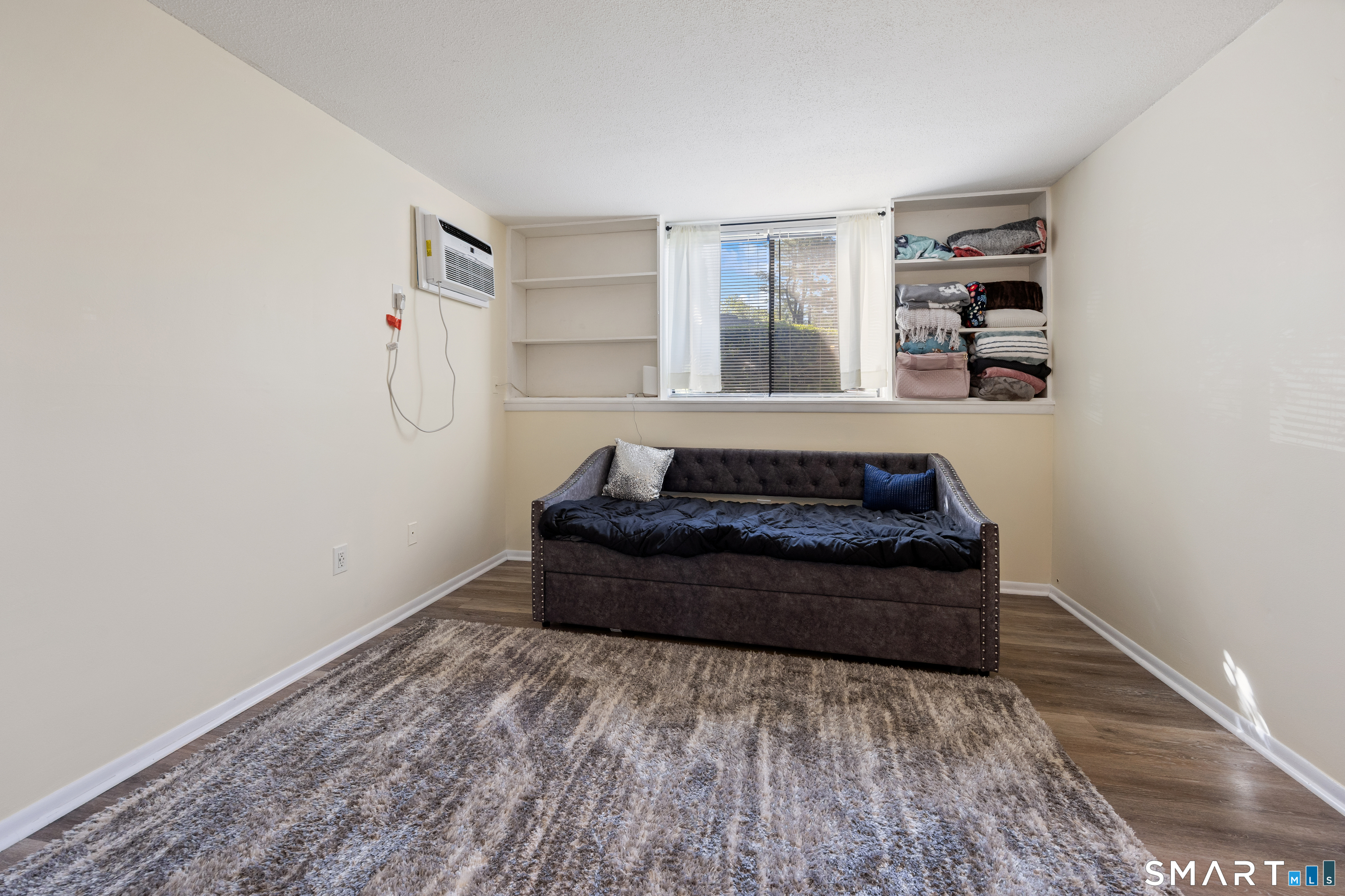 560 Yale Avenue, Unit 82 Meriden, CT 06450 - Photo 18 of 22 a spacious bedroom with a bed and a window