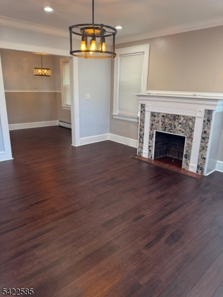 14 Commonwealth Avenue Newark, NJ 07106 - Photo 2 of 5 wooden floor fireplace and windows in an empty room