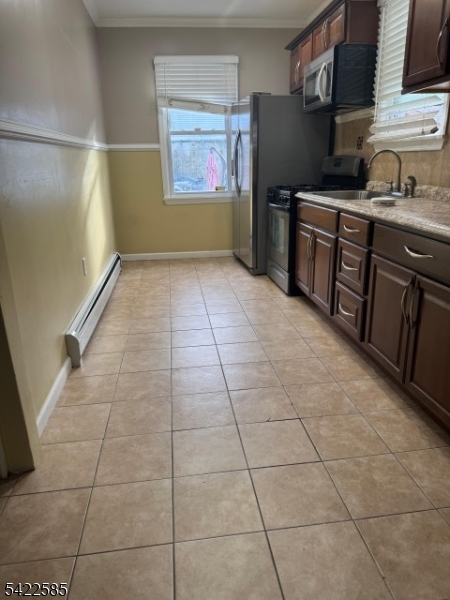 14 Commonwealth Avenue Newark, NJ 07106 - Photo 5 of 5 a kitchen with granite countertop a stove a sink and a refrigerator