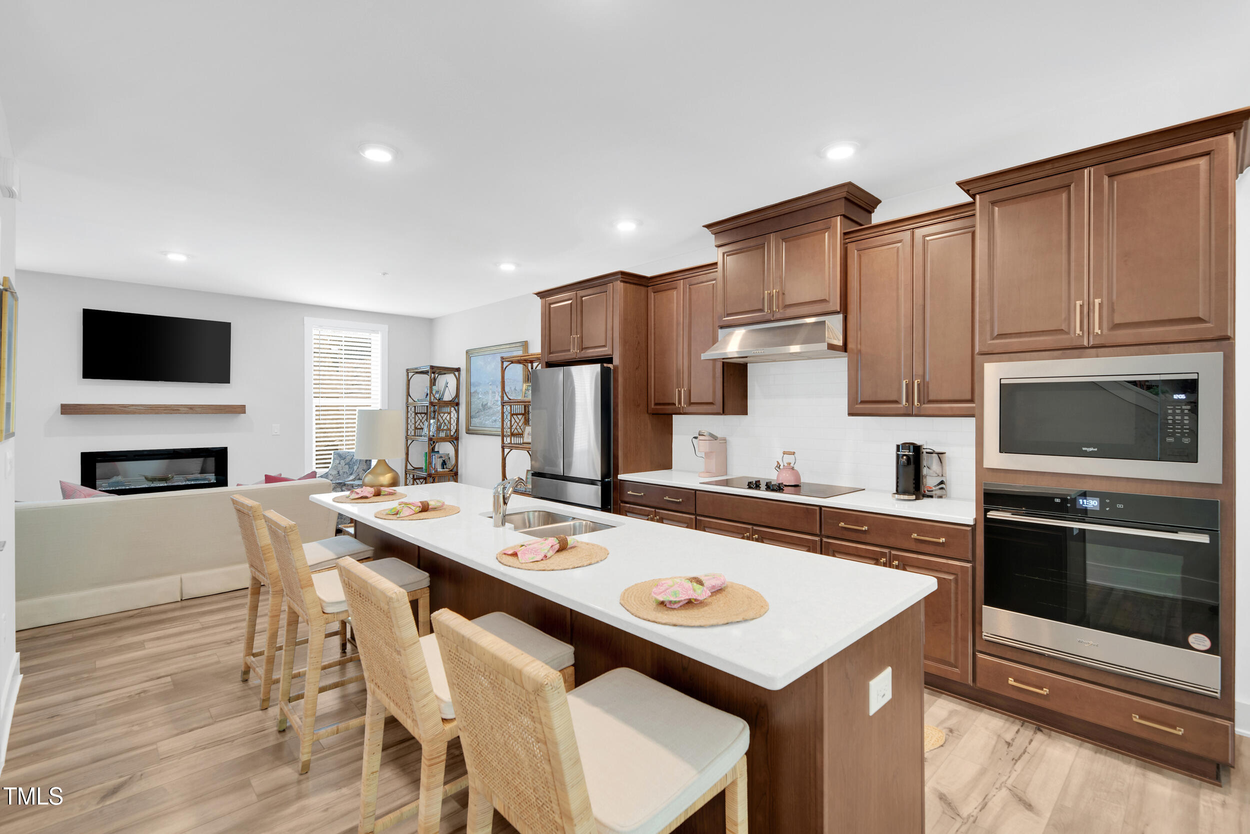 11549 Helmond Way, Unit 107 Raleigh, NC 27617 - Photo 7 of 33 a kitchen with a stove a microwave and a refrigerator