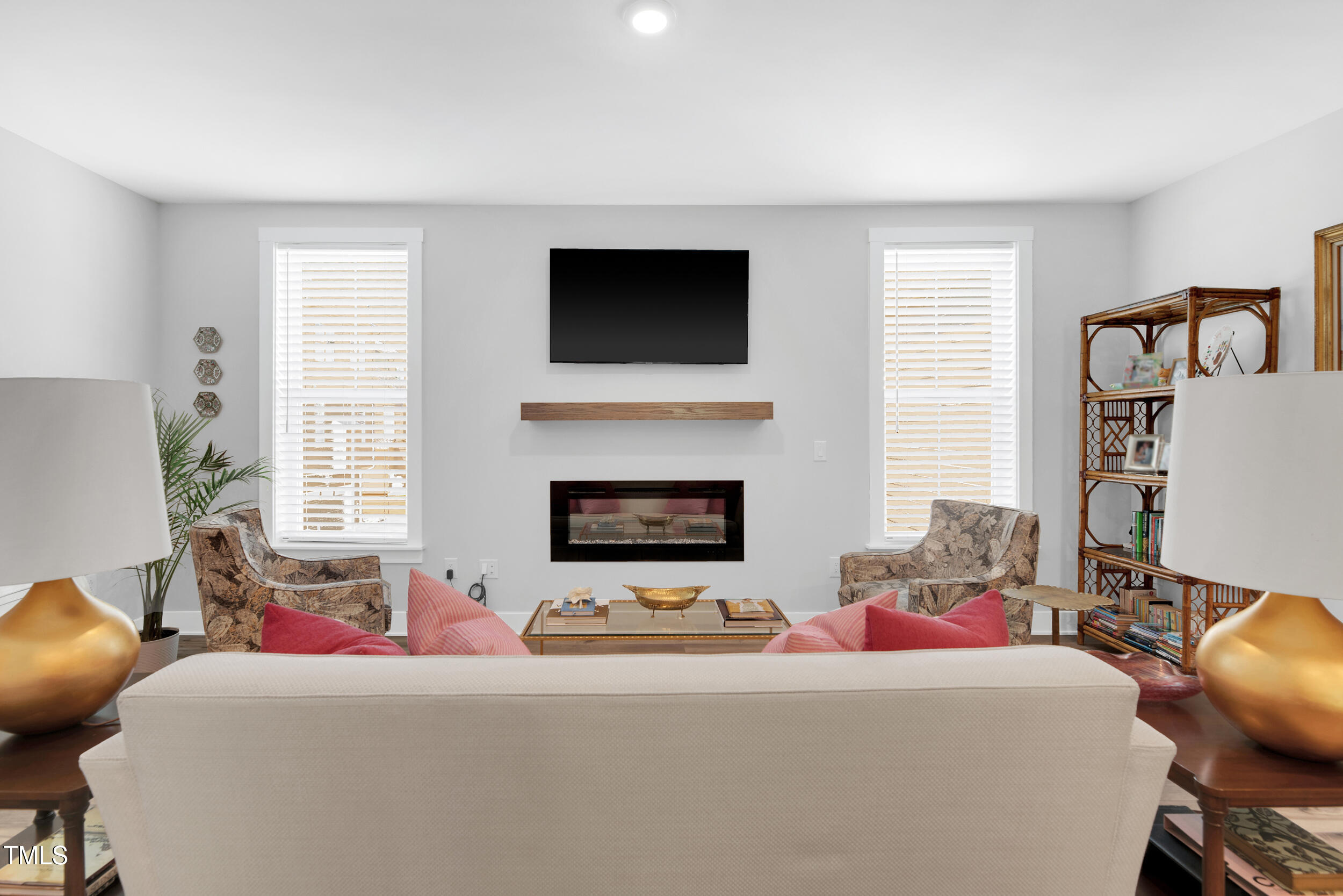 11549 Helmond Way, Unit 107 Raleigh, NC 27617 - Photo 10 of 33 a living room with furniture and a fireplace