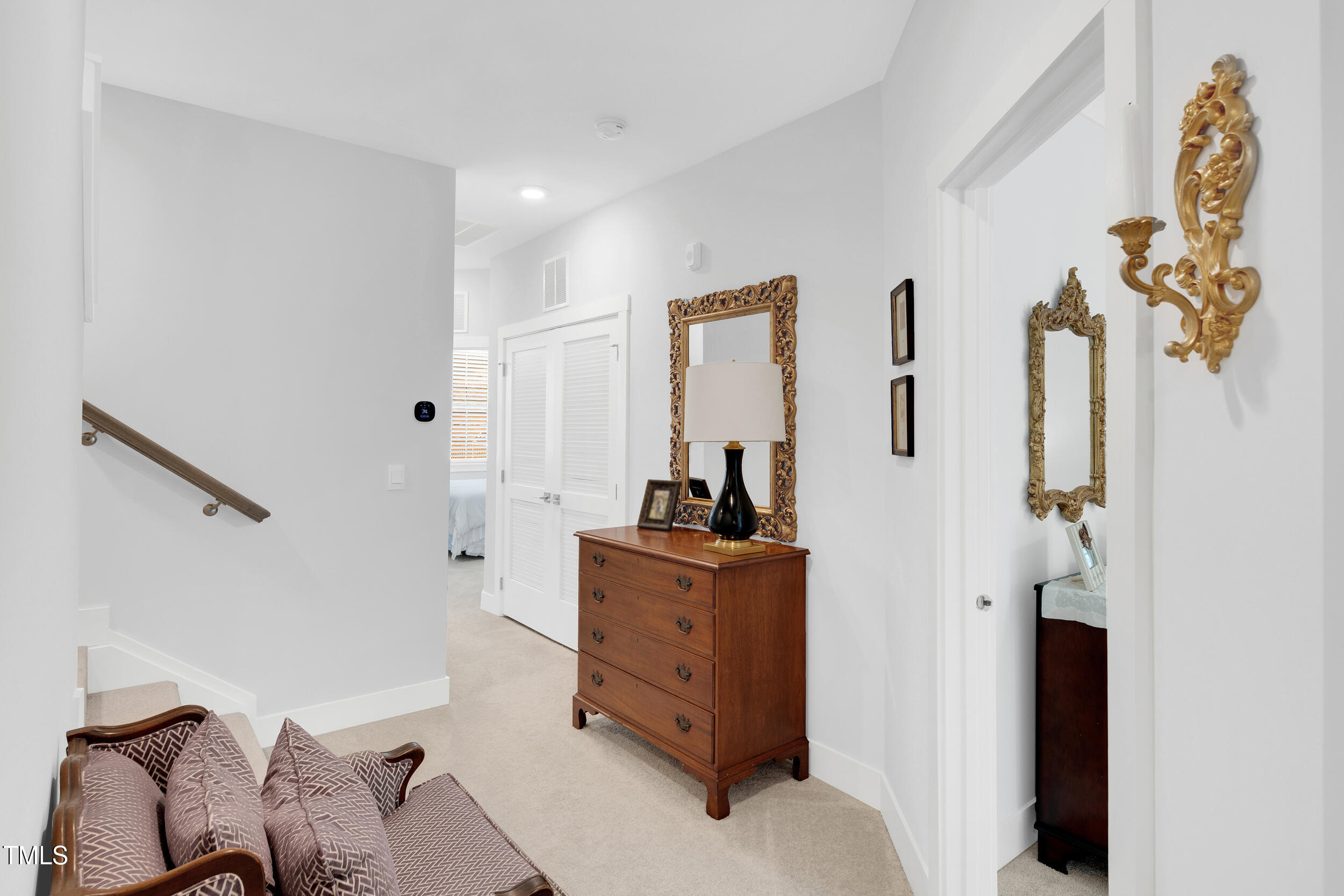 11549 Helmond Way, Unit 107 Raleigh, NC 27617 - Photo 13 of 33 a hallway with a washer and dryer