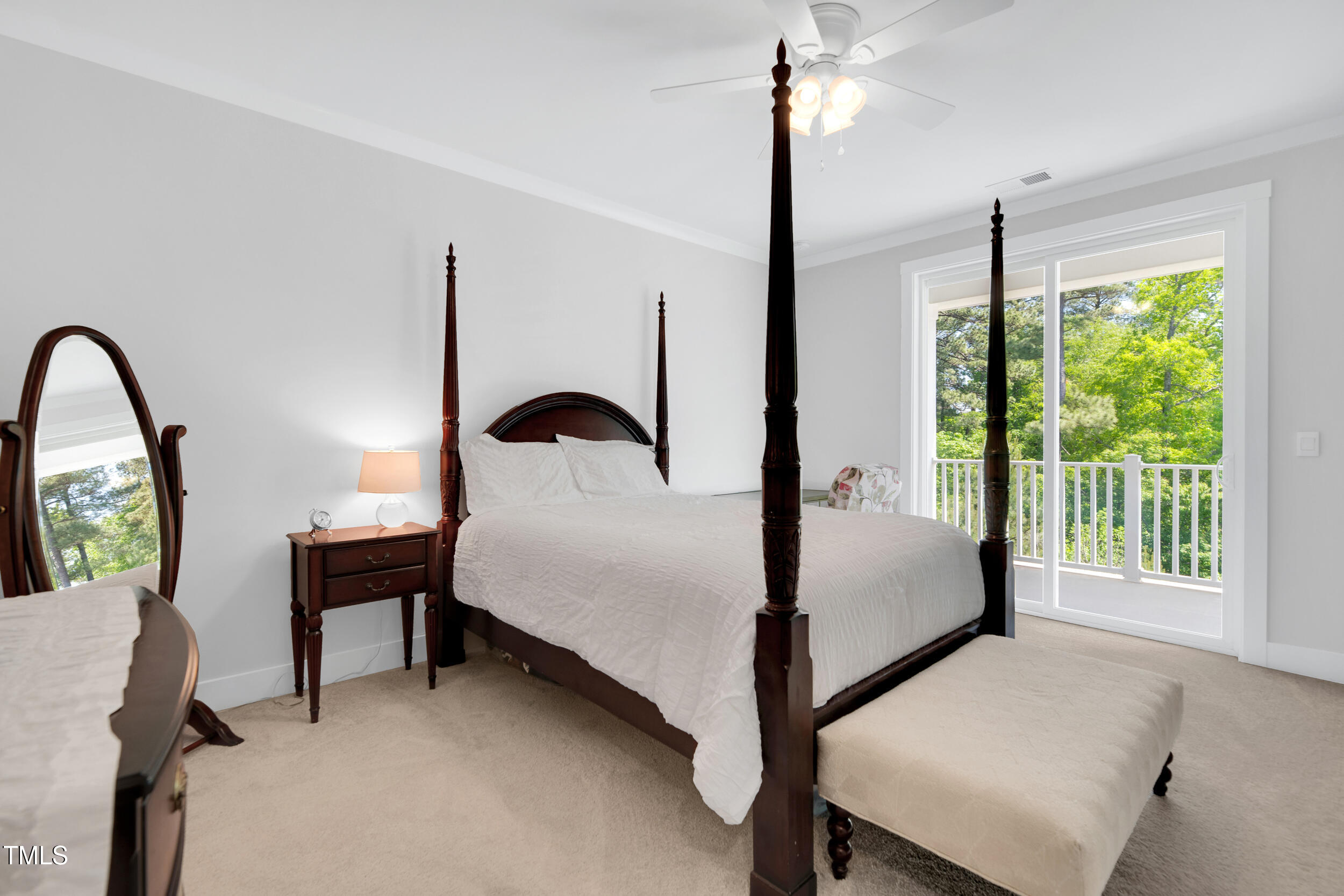 11549 Helmond Way, Unit 107 Raleigh, NC 27617 - Photo 14 of 33 a bed room with a bed and a potted plant