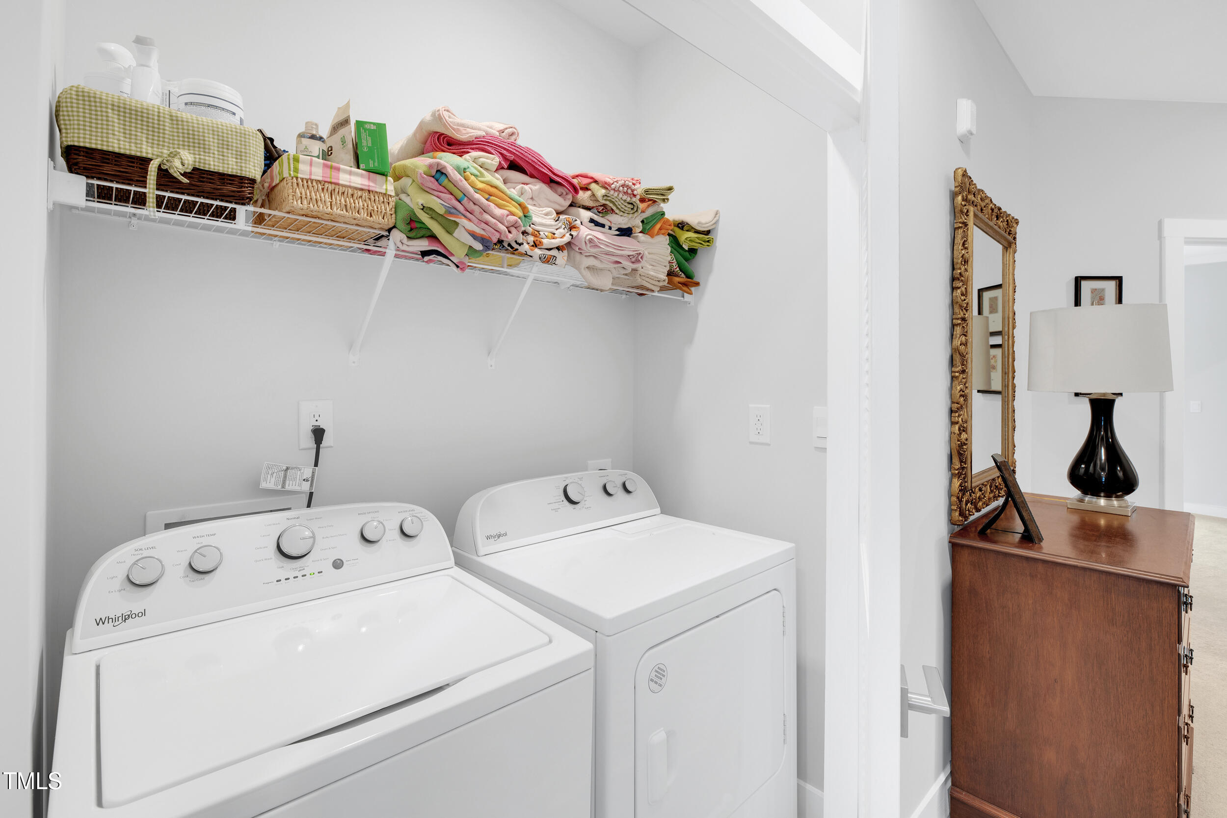 11549 Helmond Way, Unit 107 Raleigh, NC 27617 - Photo 19 of 33 a view of storage room with washer and dryer
