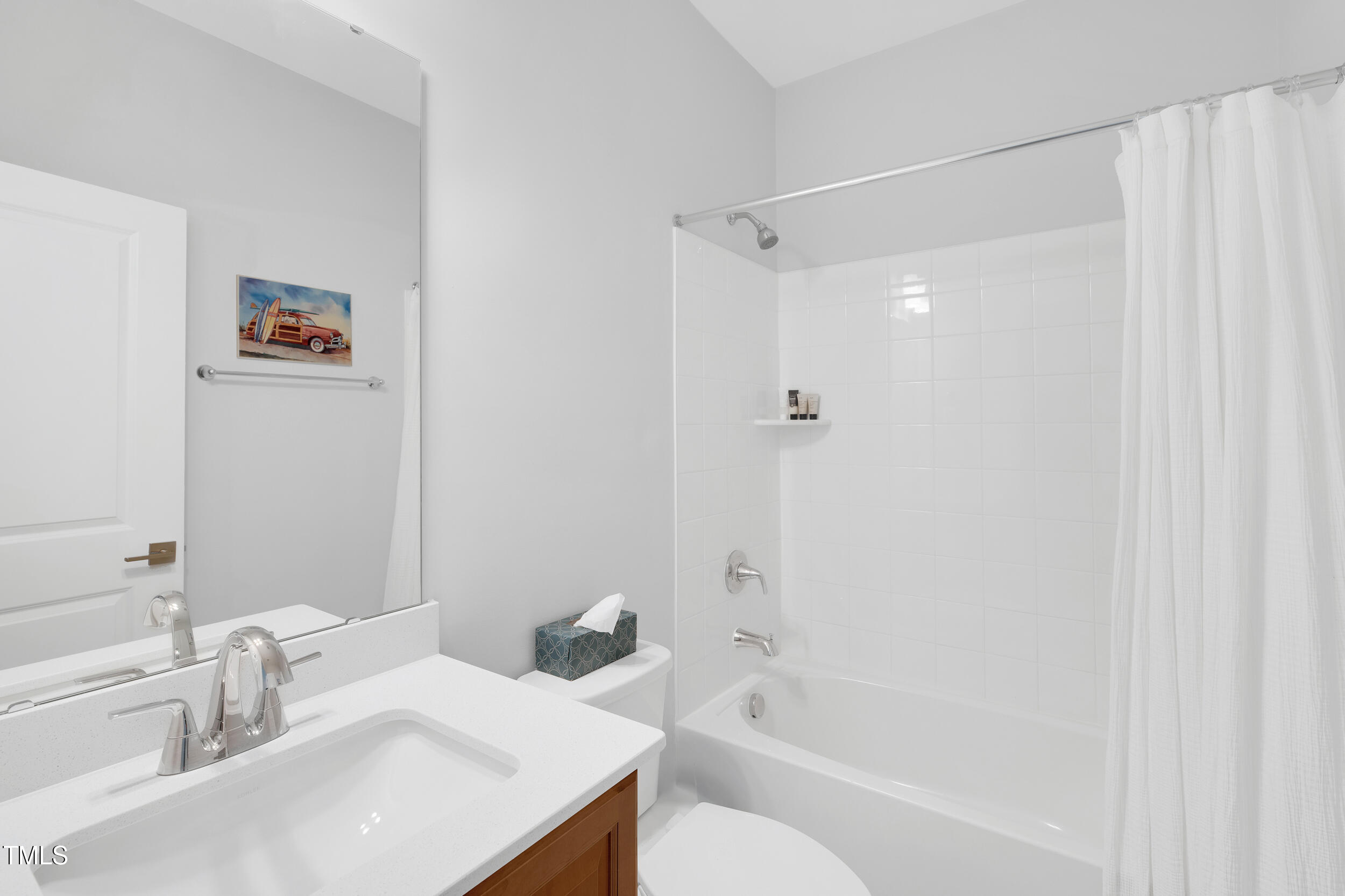 11549 Helmond Way, Unit 107 Raleigh, NC 27617 - Photo 21 of 33 a bathroom with a sink and a mirror