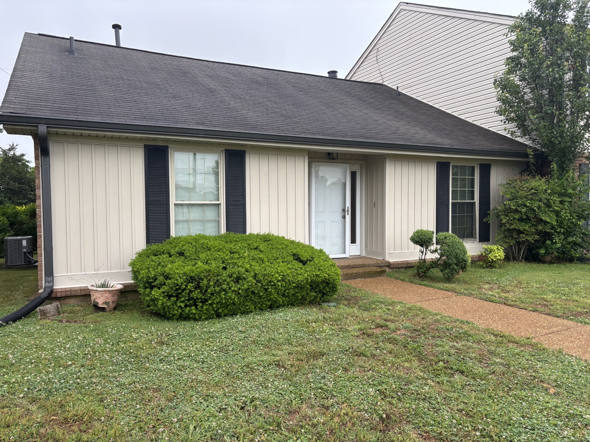 4001 Anderson Road, Unit C115 Nashville, TN 37217 - Photo 1 of 19 a front view of a house with garden