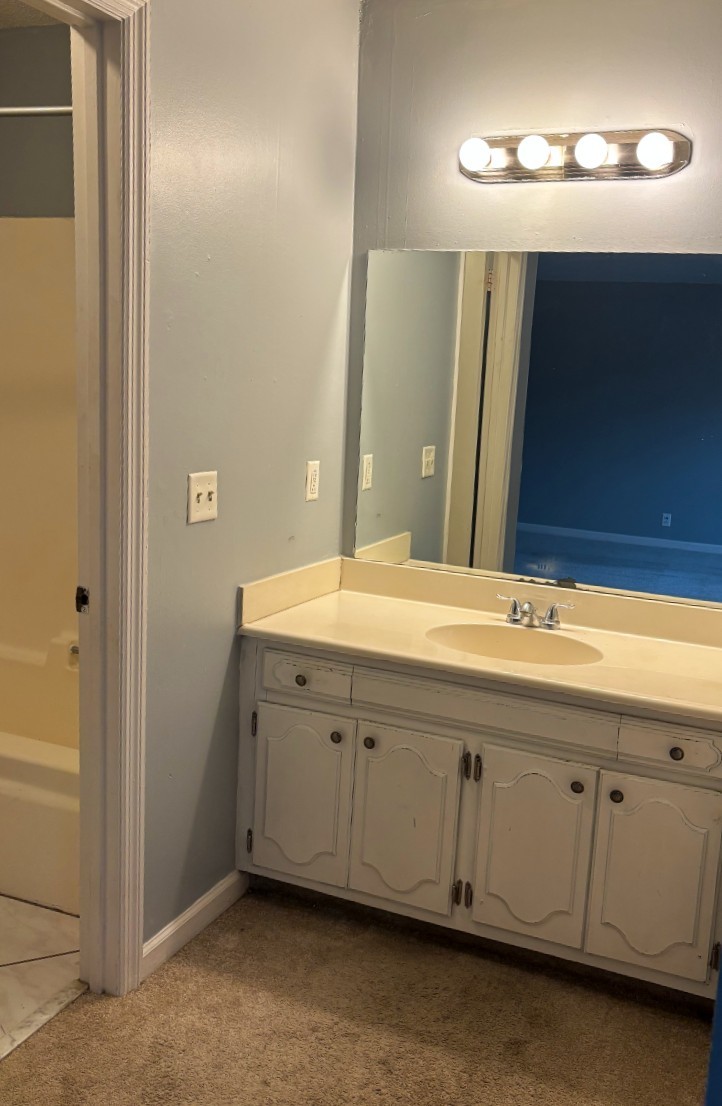 4001 Anderson Road, Unit C115 Nashville, TN 37217 - Photo 8 of 19 a bathroom with a double vanity sink and a mirror