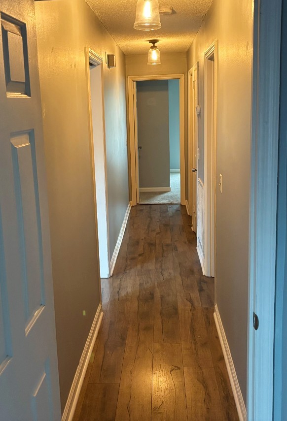 4001 Anderson Road, Unit C115 Nashville, TN 37217 - Photo 10 of 19 a view of a hallway with wooden floor