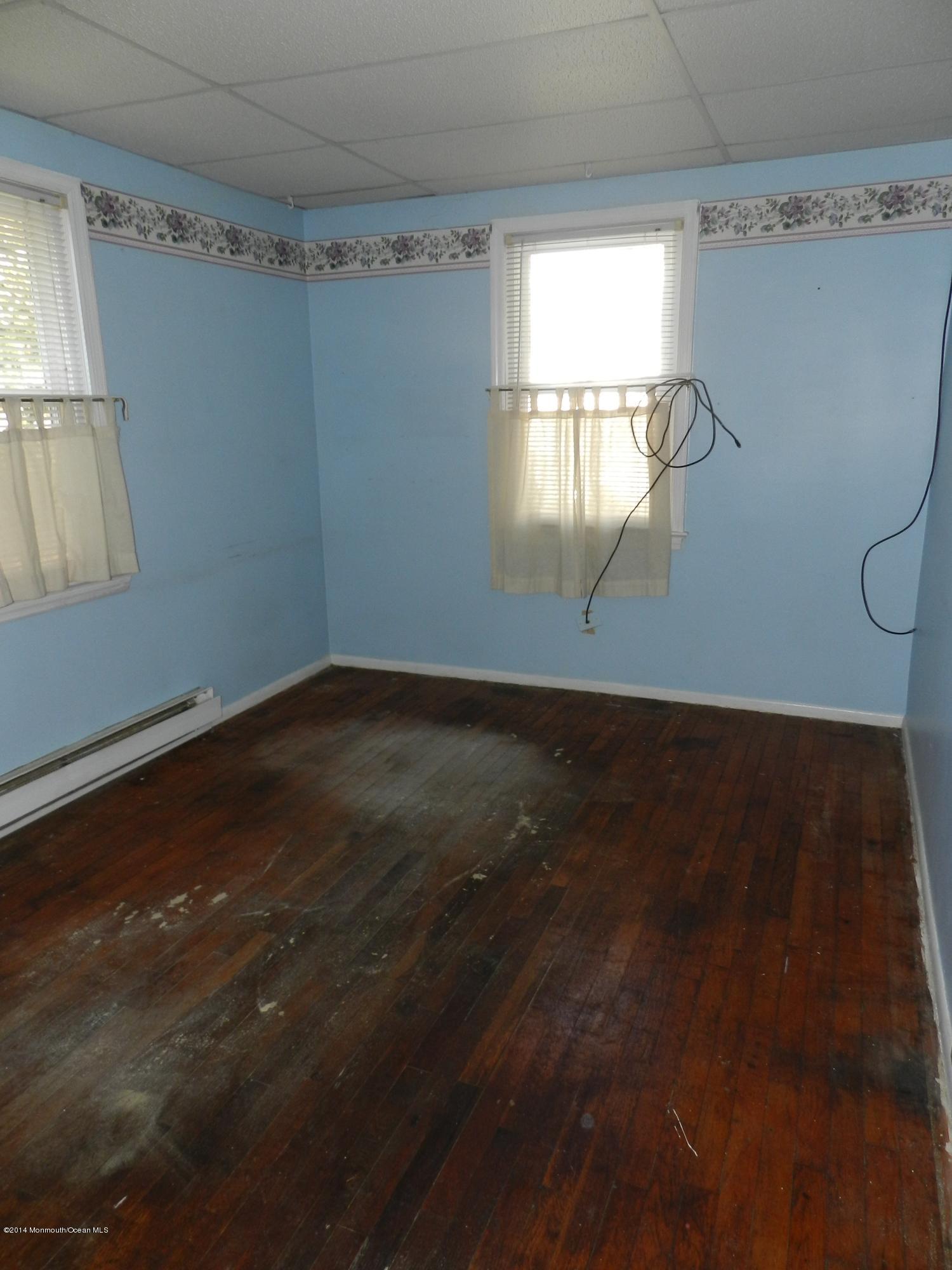 1403 Dorsett Dock Road Point Pleasant, NJ 08742 - Photo 6 of 18 a view of room with window and hardwood floor