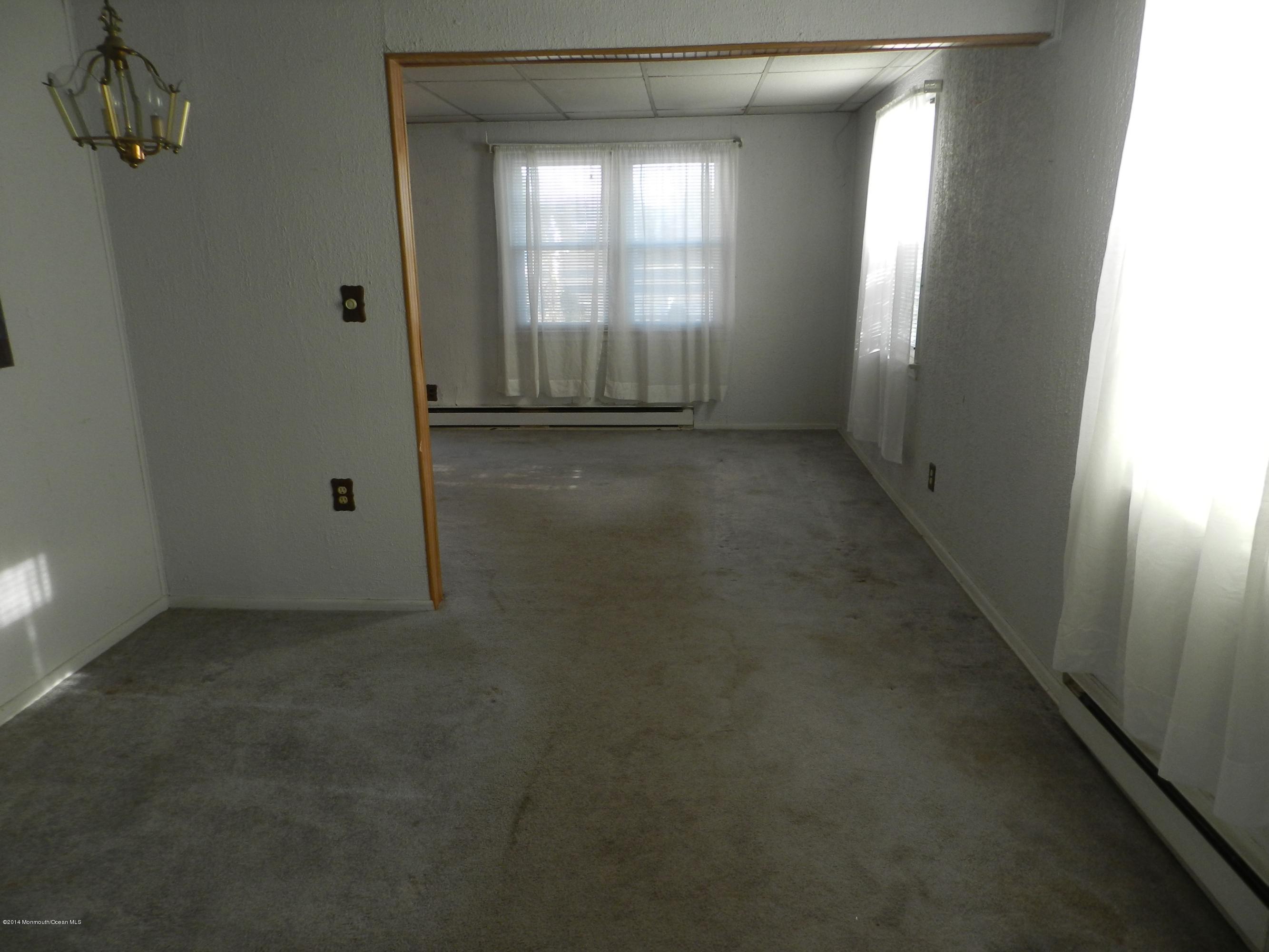 1403 Dorsett Dock Road Point Pleasant, NJ 08742 - Photo 9 of 18 an empty room with windows